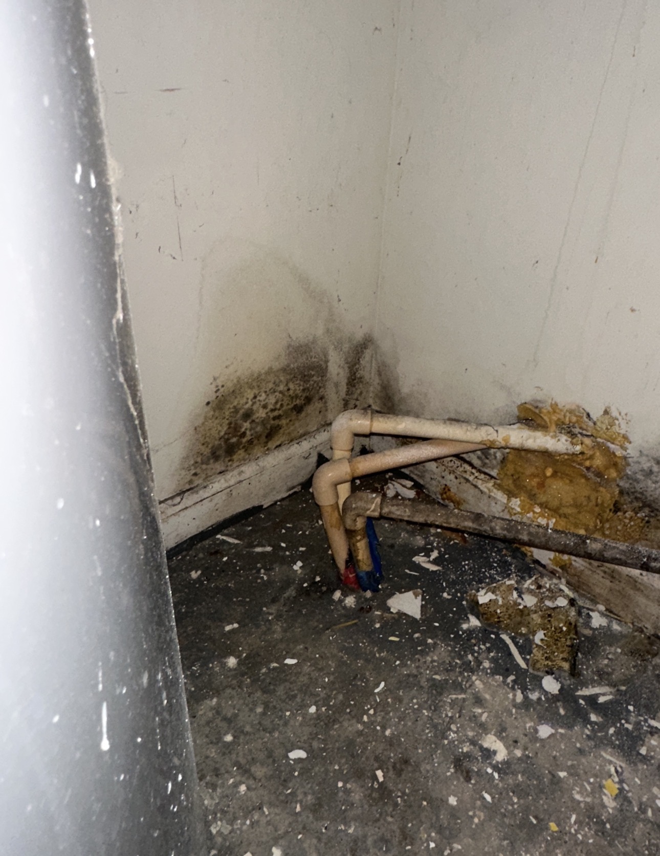 Water damage restoration equipment in a damaged room
