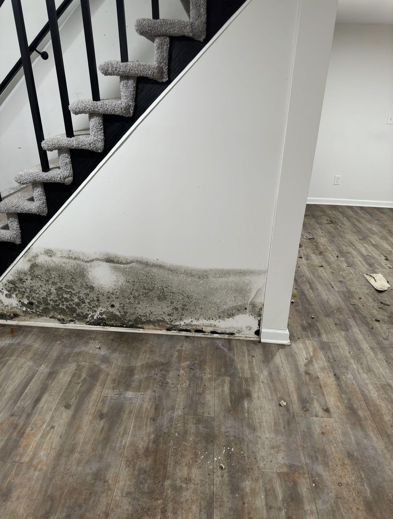 Water damage restoration equipment in a damaged room